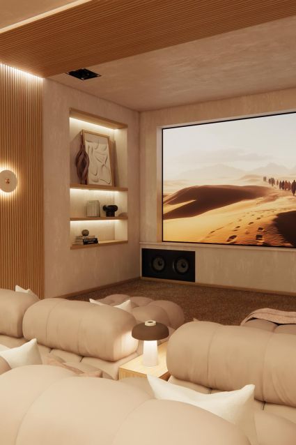 Cozy home theater with beige seating and desert landscape on screen