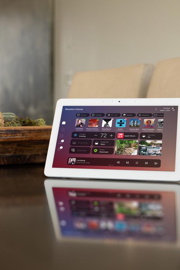 Smart home control panel on a tablet displaying music, lighting, and security options