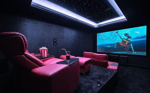 Home theater with red seating and star ceiling